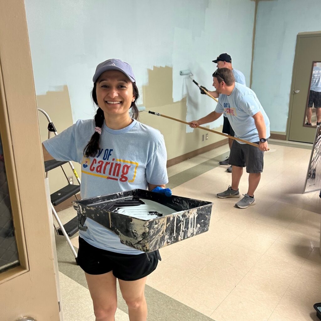 United employees painting during the United Way Day of Caring